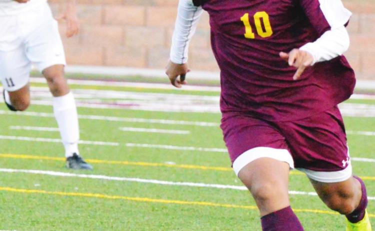 Clinton midfielder Marco Gonzalez dribbles up the field in a game against Chickasha last year. Gonzalez nearly put up 20 goals and 20 assists across the 2018-2019 seasons. CDN | Collin Wieder