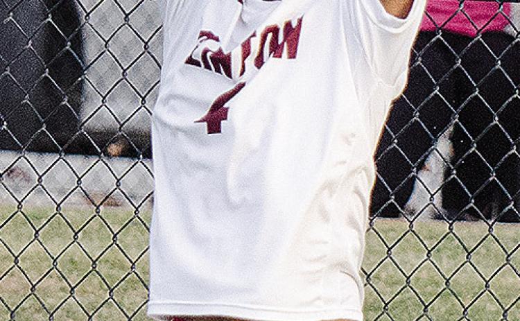 No. 4 Ruben Labastida puts all of his might behind his throw as he prepares to send the ball back into play during Clinton’s win over Weatherford. CDN | Sam Goodwyn