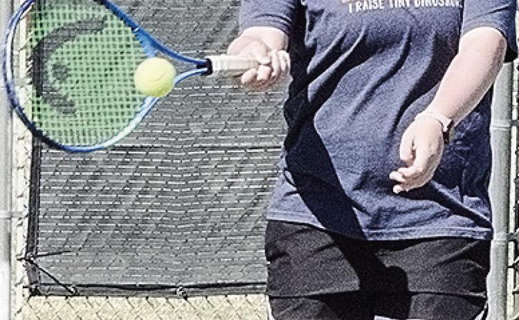 Clinton’s Sami Hammans hits the ball back over the net during tennis practice at the high school. CDN | Sam Goodwyn