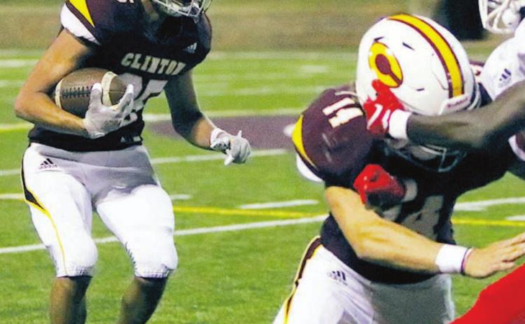 Garrison Rhoads (25) looks to take the ball up field versus Cache
