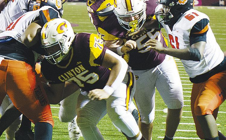 Clinton’s No. 75 Eli Anderson and No. 55 Bryson Snider work to open a hole for a ball carrier to run through in the Red Tornadoes’ home game against Douglass to end the regular season. CDN | Micah Ashcraft