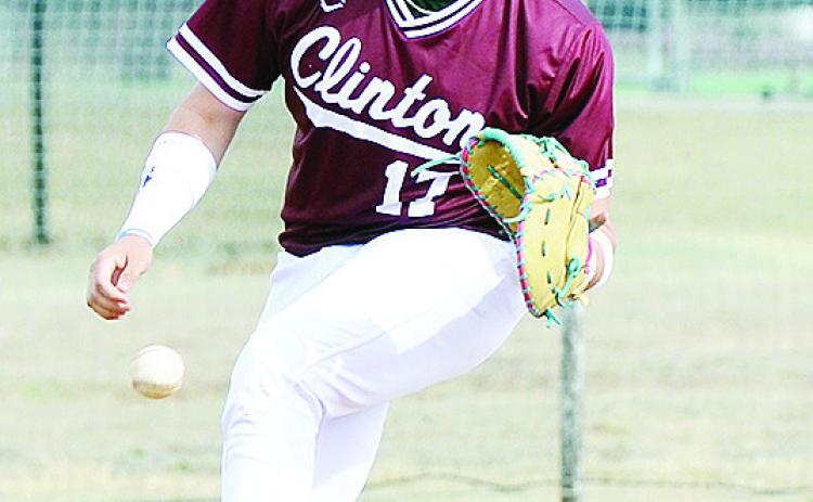 Clinton’s Kadon Rivera focuses on the ball as he prepares to catch it during the Reds’ game against Leedey. CDN | Sam Goodwyn