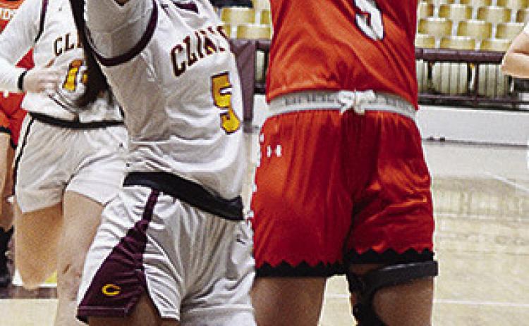 Clinton’s Lillian Lime defends against a Lindsay player during the Lady Reds’ game against the Leopardettes in the Tornado