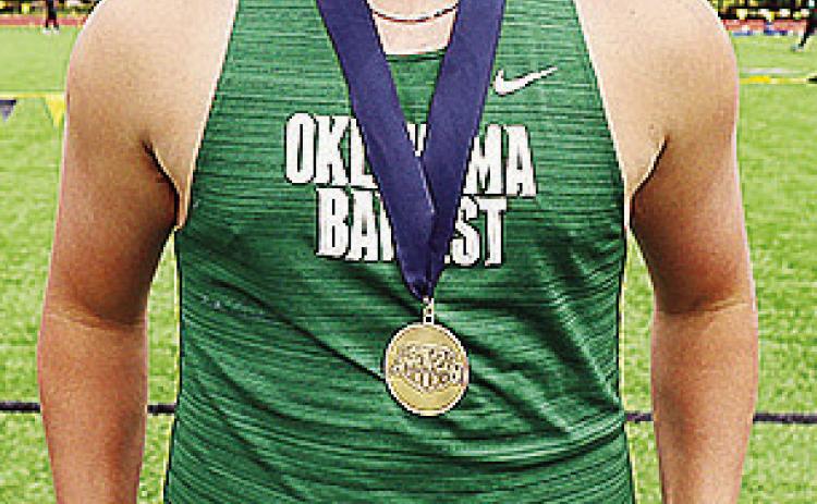 Former Clinton track and field athlete Wyatt Willougby smiles as he shows off his medal from a meet this year with Oklahoma Baptist University. CDN | Courtesy photo