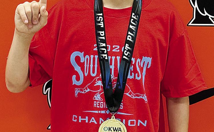 Mason Hileman smiles with his gold medal after placing first in the Southwest Regional Tournament that was held in Norman. He will wrestle at the OKWA State Tournament starting Friday in Oklahoma City. CDN |Courtesy Photo