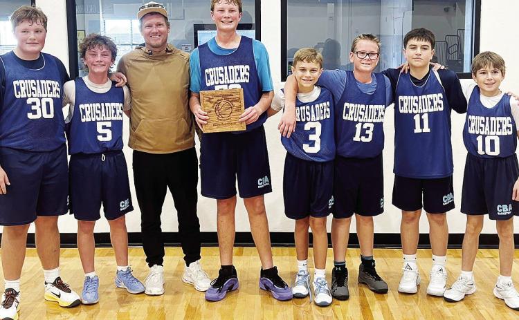 Corn Bible Academy’s seventh- and ninth-grade boys’ basketball is all smiles after finishing third at the Olustee Basketball Tournament. Pictured, from left, are Lawson Roberson, Graham Murray, Matt Murray, Nathan Cooke, Caleb Clabaugh, Ethan Cooke, B