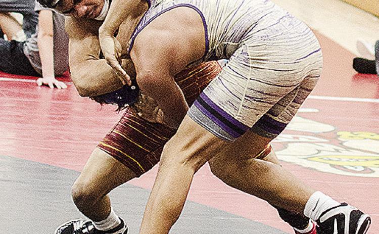 Clinton’s Tyson Brookter, left, grapples with his opponent during the Max Dippel Memorial Wrestling Tournament in Weatherford this season. CDN | Sam Goodwyn