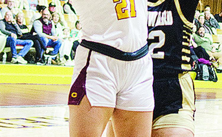 Clinton’s Rhylee Rodebush goes up for a contested layup during the Lady Reds’ home game Friday against Woodward. CDN | Sam Goodwyn