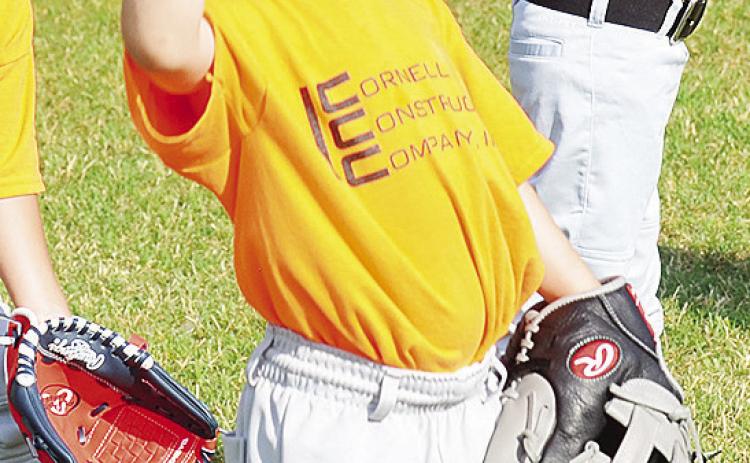 Robert Cornell throws the ball prior to his Noon Lions TBall game at Schumacher Fields at Acme Brick Park. CDN | Sam Goodwyn