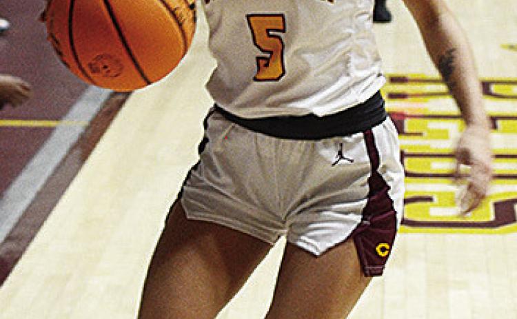 Clinton’s Lillian Lime dribbles the ball down the court during the Lady Reds’ recent home game against the Elk City Elkettes in the Tornado Dome. CDN | Sam Goodwyn
