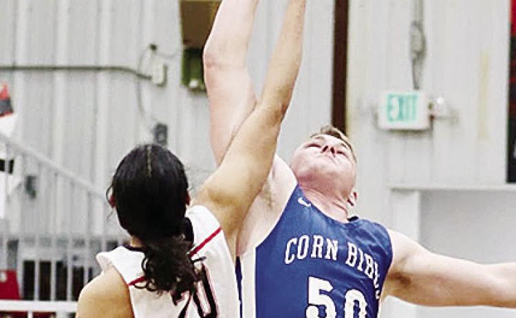 Corn Bible Academy’s Cruz Bittle, right, jumps for the tip to start a game this season on the road. CDN | Courtesy photo