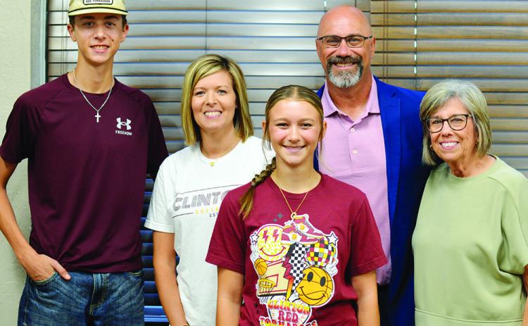 Nathan Meget was named superintendent of Clinton Pubic Schools Friday. From left are his son, Conner, his wife, Shea, his daughter, Hadley, Meget, and his mother, Teresa Grant.
