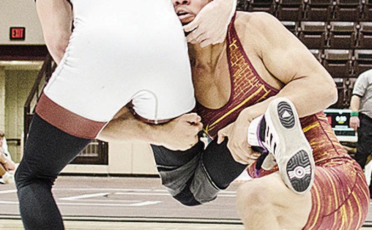 Clinton’s Tyson Brookter attempts a single-leg takedown during the Class 4A District 1 Dual Tournament Tuesday at Elk City. CDN | Sam Goodwyn