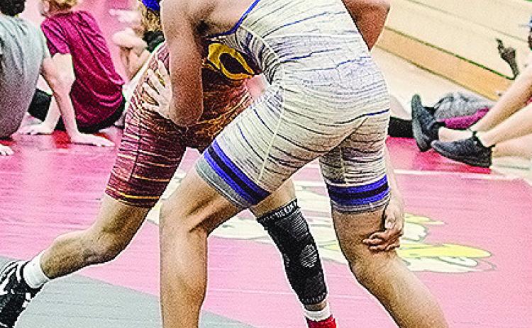 Clinton’s Tyson Brookter, top, grapples with his opponent during the recent Max Dippel Wrestling Tournament in Weatherford. CDN | Sam Goodwyn