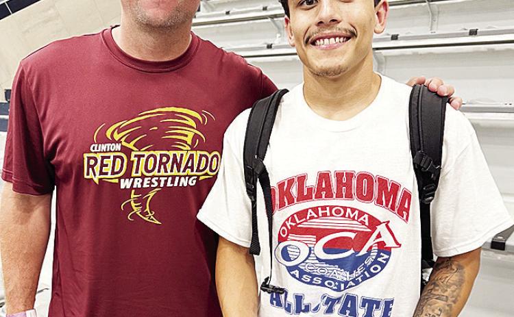 Clinton’s Tristan Cardenas, right, smiles with Clinton wrestling coach Rhett Blundell after competing in the All-State Wrestling Match Thursday at Edmond North High School. CDN | Courtesy photo